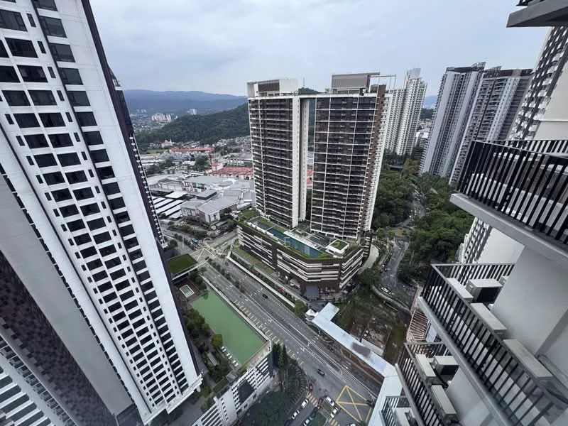 Exterior type: high-rise condominium; features: multiple high-rise buildings, landscaped rooftop garden, swimming pool on rooftop, surrounding greenery, city skyline in background, roadway visible below, urban setting, balconies on buildings; style: modern.