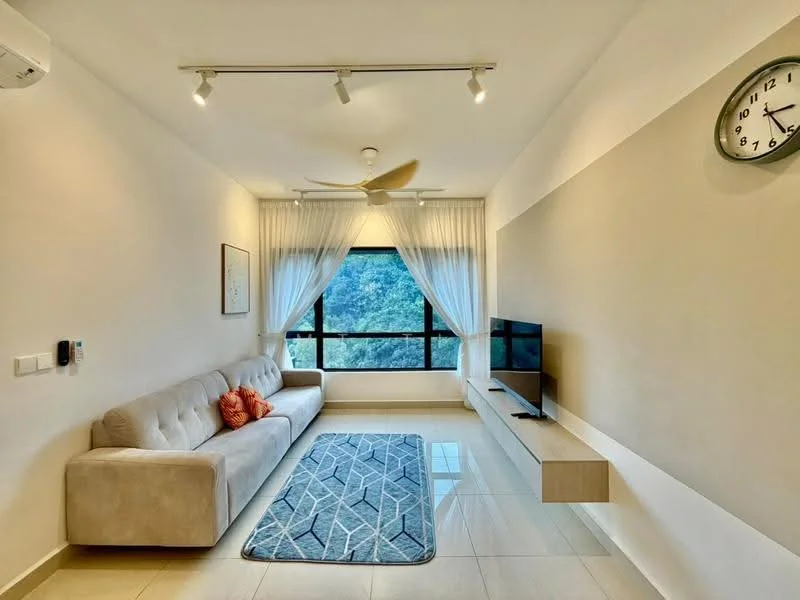 Living features: 3-seater fabric sofa in light grey, decorative orange throw pillow, area rug with geometric pattern, wall-mounted TV, floating TV console, floor-to-ceiling windows, sheer curtains, recessed downlights, ceiling fan with light, clock on wall, cream painted walls, glossy tile flooring; style: modern; view: garden.