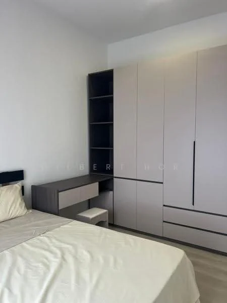 Bedroom features: queen-size bed with beige bedding, built-in wardrobe with light grey finish, study desk with matching light grey finish, white walls, light wood flooring, window with natural light, minimalist decor; style: modern.