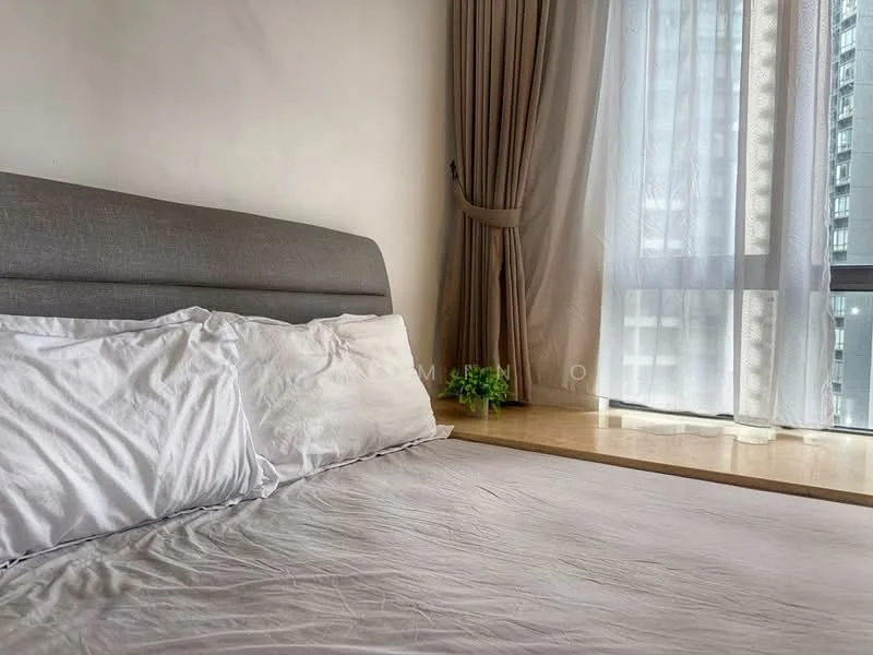Bedroom features: king-size bed, upholstered headboard, white bedding, floor-to-ceiling windows, sheer curtains, wooden window sill, decorative plant, neutral wall colour, laminate flooring; style: modern; view: city.