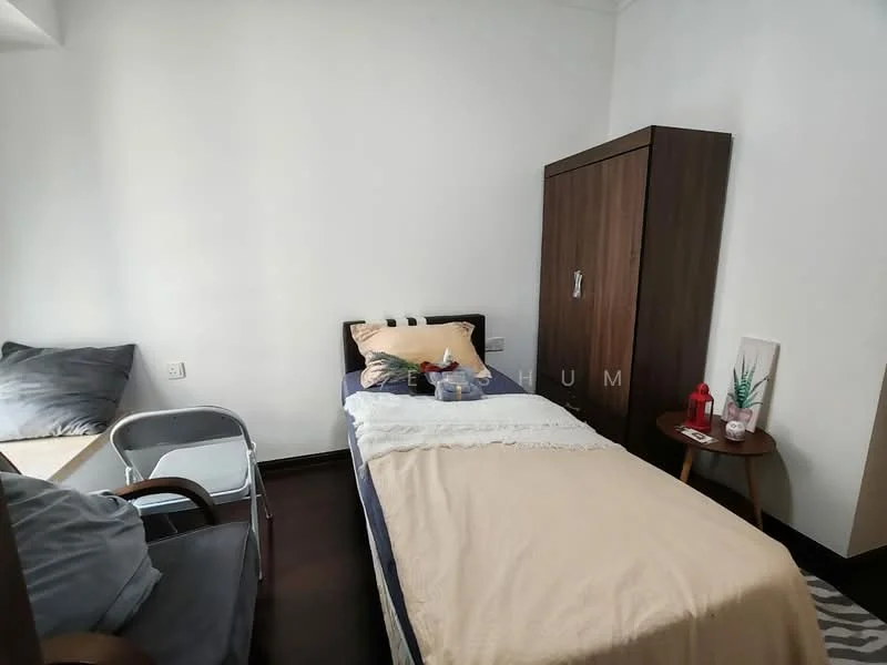 Bedroom features: single bed with beige bedding, wooden wardrobe with sliding doors, dark wood flooring, white painted walls, window with natural light, small bedside table, decorative items on bedside table, chair, cushioned seating area by the window; style: modern.