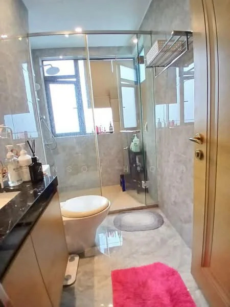 Bathroom features: glass shower enclosure, rain shower head, handheld shower, single-sink vanity with black granite countertop, wood cabinetry, white toilet, mirror above vanity, tile flooring, grey wall tiles, pink bath mat; style: modern.