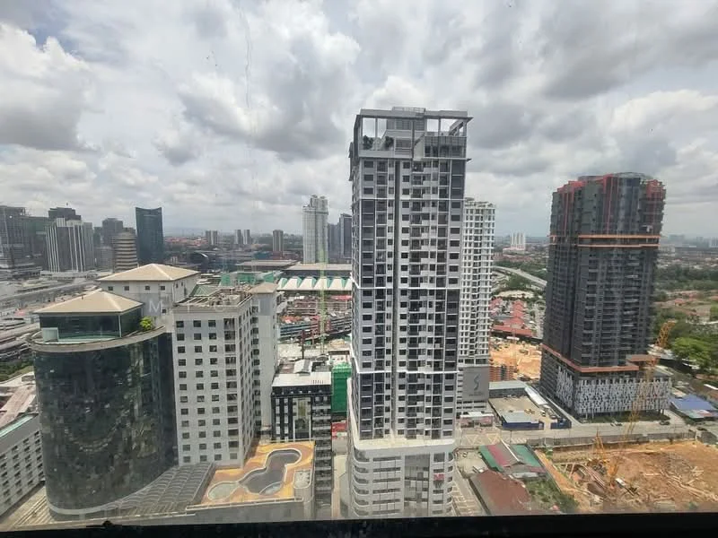 Exterior type: high-rise condominium; features: glass curtain wall, recessed balconies, multiple-storey buildings, surrounded by urban landscape, construction site visible, city skyline in background; style: modern.