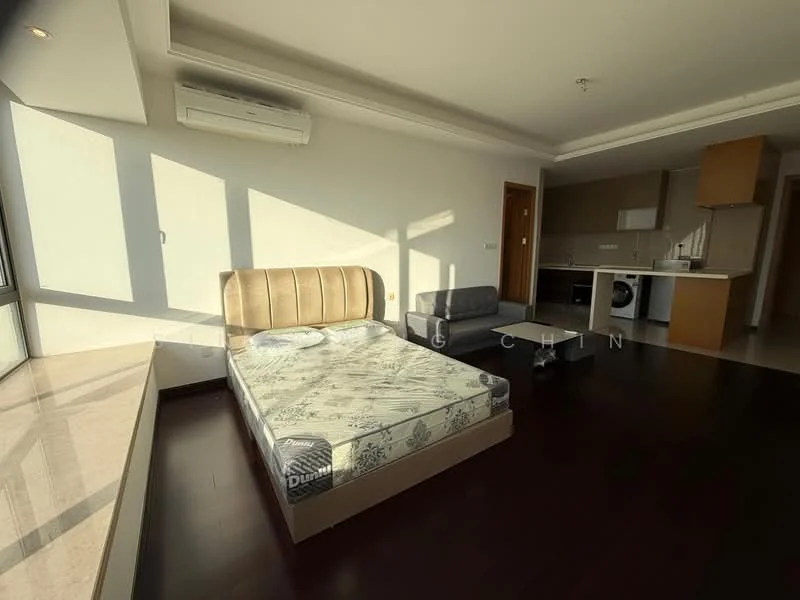 Room features: queen-size bed, upholstered headboard, wooden flooring, floor-to-ceiling windows, air conditioning unit, kitchenette with cabinets, countertop, washing machine, light-colored walls, natural light from windows, small dining table, seating area; style: modern; view: city.