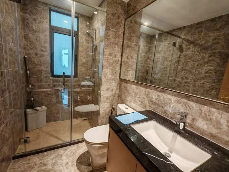 Bathroom features: single-sink vanity with dark marble countertop, mirror above vanity, built-in storage cabinet, one-piece toilet, walk-in shower with glass enclosure, rain shower head, handheld shower, tile cladding on walls, cream marble flooring, recessed lighting; style: modern.