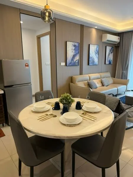 Dining features: round marble dining table, 4 upholstered dining chairs in grey, set of white dinner plates, gold cutlery, decorative centerpiece with greenery, wall-mounted air conditioning unit, light fixture with metallic finish, framed artwork on walls, cream painted walls, white tiled flooring, sofa in living area visible in background, floor-to-ceiling windows with natural light; style: modern; view: city. Living features: beige fabric sofa, decorative cushions, coffee table, wall-mounted TV, artwork on walls, light-colored curtains, open layout to dining area; style: modern. Kitchen features: stainless-steel fridge, wood cabinetry, countertop with bar stools, kitchen appliances visible in background; style: modern.