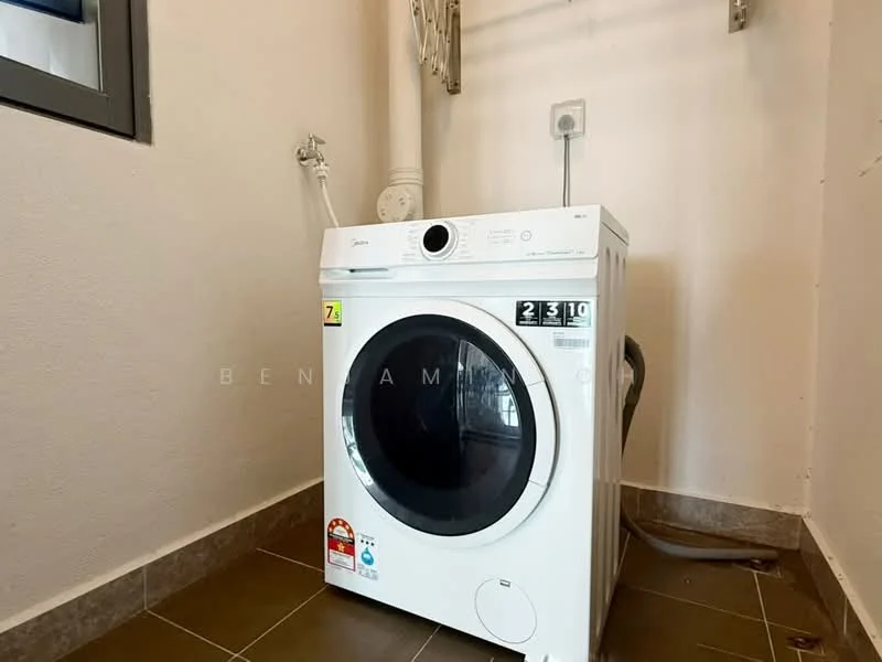 Laundry features: front-load washing machine in white, drainage pipe, electrical outlet, grey tiled flooring, white painted walls.