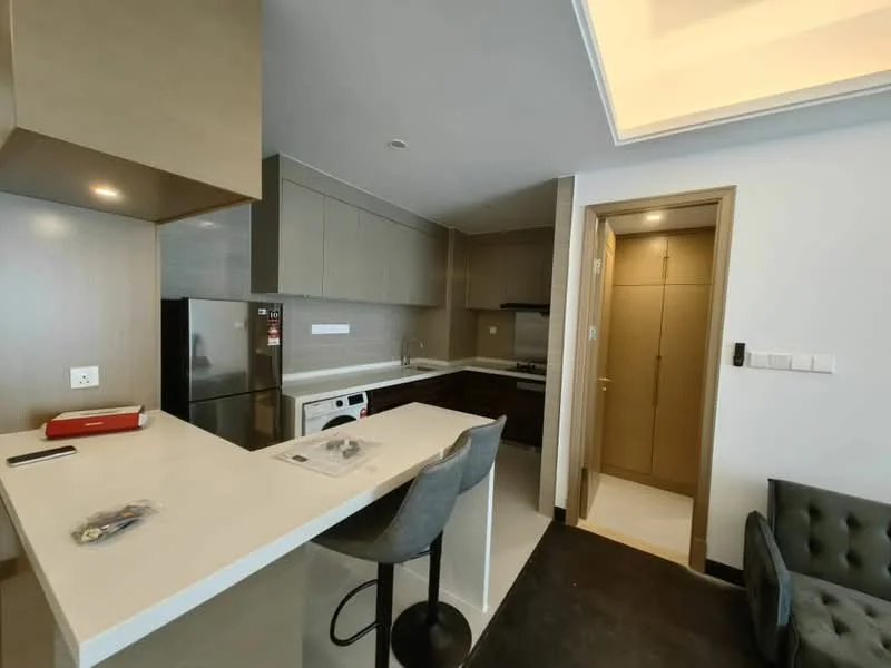 Kitchen features: white quartz countertop, stainless-steel sink, chrome pull-down faucet, built-in oven, freestanding range oven, stainless-steel fridge, white cabinetry, grey wall cabinets, tile backsplash, recessed downlights, bar stools, open layout, dark tile flooring, door to hallway; style: modern.