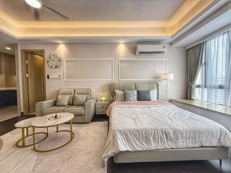Bedroom features: king-size bed with light-colored bedding, upholstered headboard, 2 bedside lamps, coffee table with gold frame, 2-seater fabric sofa in light grey, floor-to-ceiling window with sheer curtains, recessed ceiling lights, wall-mounted air conditioning unit, wooden flooring, decorative wall paneling; style: modern; view: city.