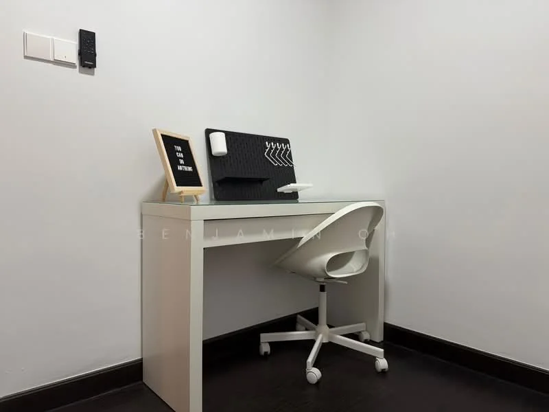 Study features: white desk, white swivel chair, black wall-mounted organizer, framed motivational quote, white wall, dark wood flooring, electrical outlet, wall-mounted intercom; style: minimalist.