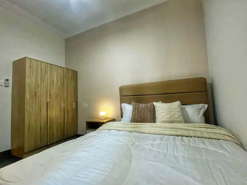 Bedroom features: queen-size bed with upholstered headboard, white bedding, wooden wardrobe, nightstand with lamp, decorative pillows, plain painted walls in beige, carpeted flooring, soft lighting; style: modern.