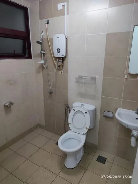 Bathroom features: one-piece toilet, wall-mounted shower with adjustable head, handheld shower, mirror above sink, sink with pedestal, cream tiled walls, beige tiled flooring, glass shower partition, towel holder, soap dispenser, shower heater; style: modern.