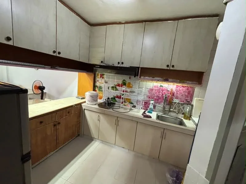 Kitchen features: laminate cabinetry in light wood, white upper cabinets, stainless-steel sink, chrome pull-down faucet, ceramic tile backsplash with floral pattern, countertop with beige surface, built-in oven, refrigerator, open shelving, wall-mounted fan, tile flooring in light color, decorative plants on shelves; style: modern.