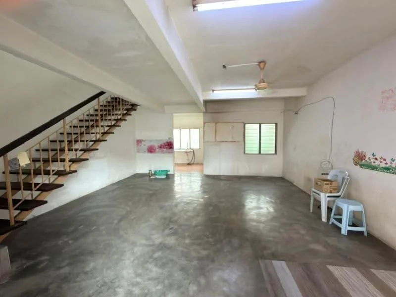 Living features: exposed concrete flooring, white painted walls, ceiling fan, staircase with wooden steps, large windows for natural light, open layout, decorative wall with floral pattern, utility area visible in background; style: minimalist.