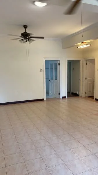 Living features: cream painted walls, tile flooring, 5-blade ceiling fan, recessed lighting, doorway leading to other rooms, two doorways, neutral color scheme, spacious layout.
