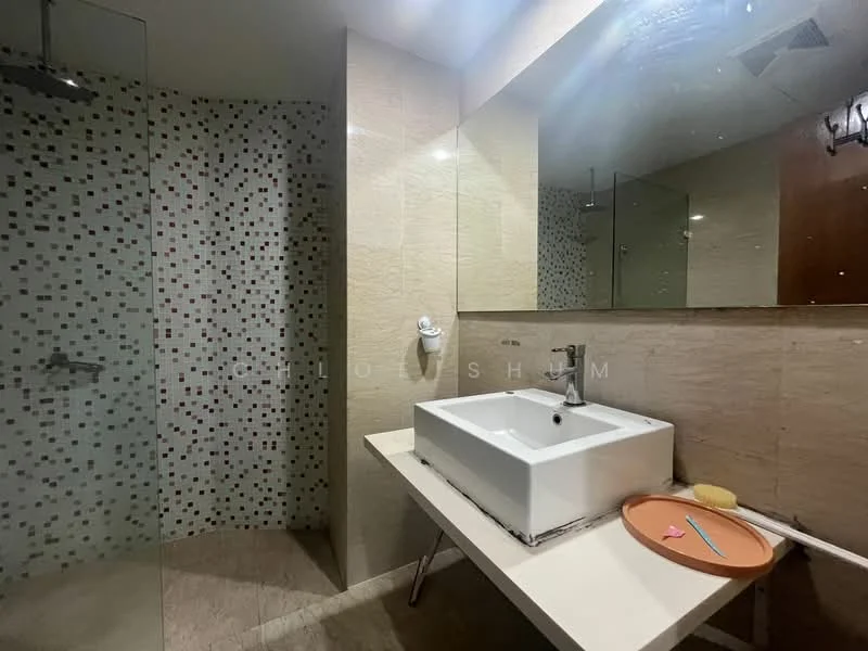 Bathroom features: white ceramic sink, chrome basin mixer faucet, wall-mounted mirror, glass shower enclosure, tile cladding with mosaic pattern, cream marble wall tiles, cream marble flooring, recessed lighting; style: modern.