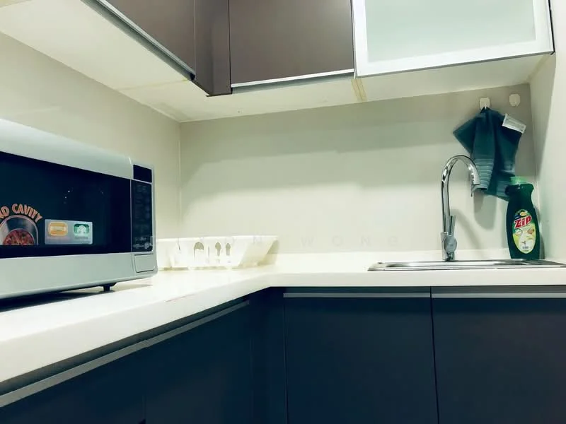 Kitchen features: white countertop, dark wood cabinetry, stainless-steel sink, chrome faucet, microwave, egg tray, dishwashing liquid bottle, green kitchen towel, white wall, under-cabinet lighting; style: modern.