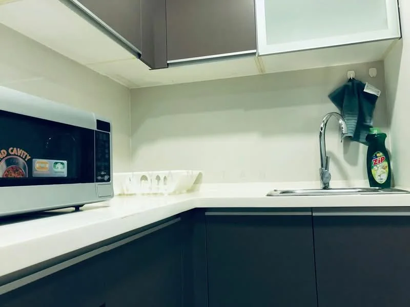 Kitchen features: grey cabinetry, white countertop, stainless-steel sink, chrome faucet, microwave, dishwashing liquid bottle, egg tray, kitchen towel; style: modern.