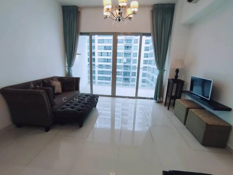 Living features: 3-seater fabric sofa in grey, tufted ottoman in dark grey, wall-mounted TV, TV console in dark wood, large floor-to-ceiling windows, sheer curtains, chandelier with multiple bulbs, glossy white tile flooring, neutral painted walls, decorative lamp on side table; style: modern; view: city.