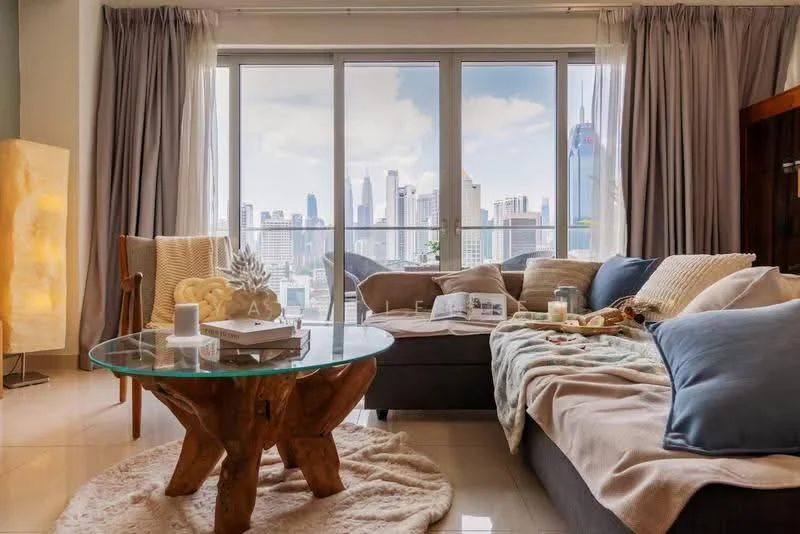 Living features: floor-to-ceiling windows, city skyline view, 3-seater fabric sofa in grey, 2-seater fabric sofa in beige, glass coffee table with wooden base, area rug with fluffy texture, decorative throw pillows, decorative blanket, table lamp with warm light, framed artwork on wall, curtains in light grey, wooden console table; style: modern; view: city.