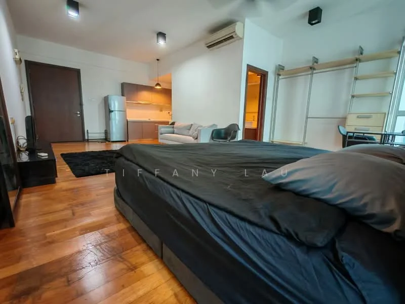 Bedroom features: king-size bed with black bedding, wooden flooring, wall-mounted air conditioning unit, black area rug, floor-to-ceiling windows, curtains, built-in shelving unit, wall-mounted TV, decorative wall paneling; style: modern; view: city. Living features: 2-seater grey fabric sofa, coffee table, open shelving, kitchenette in background, refrigerator, pendant lighting, dining table with chairs; style: modern.