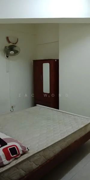 Bedroom features: white painted walls, wooden flooring, ceiling fan, single bed frame, wooden wardrobe with mirror, decorative throw pillow.