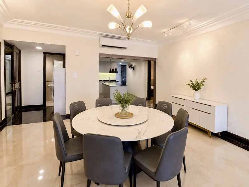 Dining features: round marble dining table, 6 upholstered dining chairs in grey, chandelier light fixture, white sideboard cabinet, cream painted walls, polished marble flooring, recessed ceiling lights, air conditioning unit; style: modern. Kitchen features: open kitchen layout, kitchen island, white cabinetry, stainless-steel appliances, black countertop; style: modern.