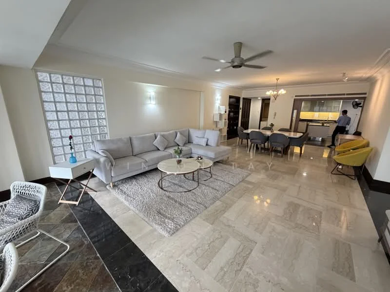 Living features: 3-seater fabric sofa in light grey, coffee table with round top, area rug with neutral color, ceiling fan with light, wall-mounted light fixtures, decorative wall with glass blocks, marble flooring, decorative mirror, potted plant, side table with blue accent, 2-seater rattan chair, yellow accent chair; style: modern. Dining features: 6-seater dining table, upholstered dining chairs, chandelier lighting, open-plan layout to kitchen; style: modern. Kitchen features: kitchen island, built-in cabinetry, stainless-steel appliances, open layout to dining area; style: modern.
