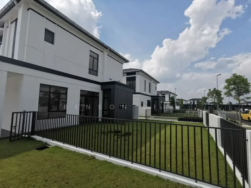 Exterior type: detached bungalow; features: white painted facade, flat roof, black accent wall, manicured lawn, fenced yard with black metal railing, multiple windows, driveway, surrounded by greenery, two-storey structure, modern architectural design; style: modern.