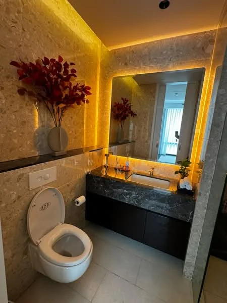 Bathroom features: one-piece toilet, single-sink vanity with dark wood cabinet, marble countertop, framed mirror, backlit mirror, stone wall cladding, recessed lighting, decorative plant, towel holder, grey tile flooring; style: modern.