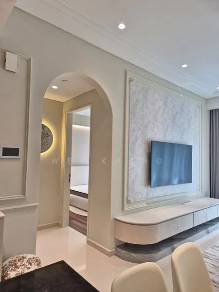 Room features: white painted walls, decorative wall paneling, recessed lighting, flat-screen TV mounted on wall, light-colored cabinetry, glossy tile flooring, arched doorway, neutral color palette; style: modern.