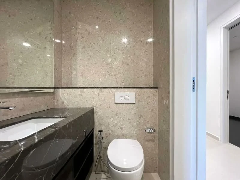 Bathroom features: marble wall cladding, black marble vanity with storage, single-sink vanity, chrome basin mixer faucet, framed mirror, one-piece toilet, dual flush mechanism, recessed lighting; style: modern.