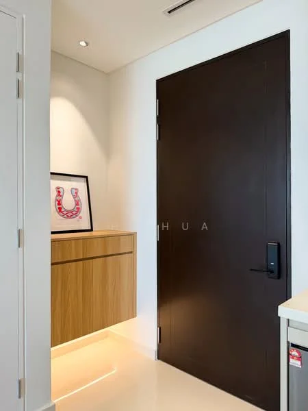 Room features: dark wooden door, white painted walls, recessed lighting, wooden console with drawers, framed artwork, light-colored flooring, illuminated baseboard; style: modern.