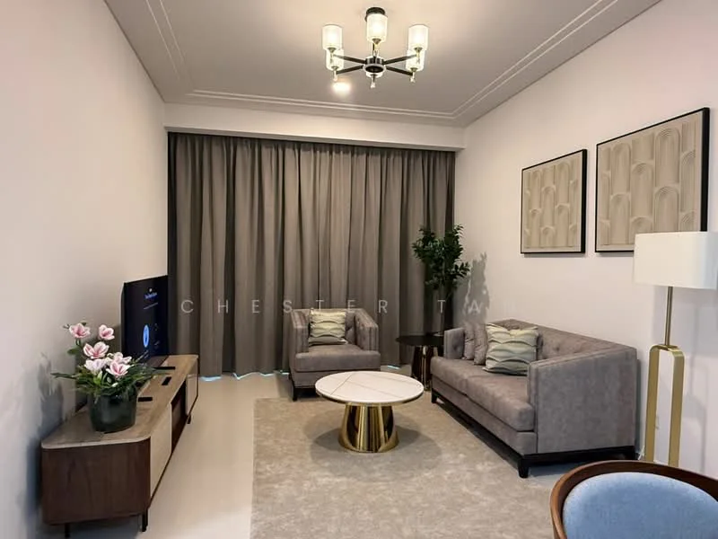 Living features: grey fabric 3-seater sofa, beige accent chair, round coffee table with gold base, TV console with drawers, wall-mounted TV, floor lamp with white shade, curtains in grey fabric, decorative wall art, houseplant in ceramic pot, area rug with neutral color; style: modern.