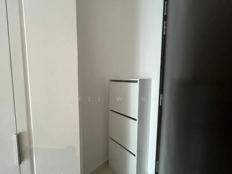 Room features: white painted walls, light-colored flooring, built-in storage cabinet with three drawers, door leading to another room; style: modern.