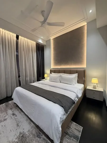 Bedroom features: king-size bed, upholstered headboard, white bedding, grey throw blanket, 2 bedside lamps, wooden nightstands, floor-to-ceiling curtains, recessed lighting, ceiling fan, decorative wall panel, area rug with neutral pattern, dark wood flooring; style: modern.