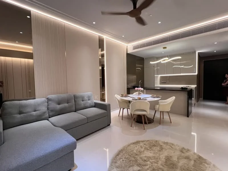 Living features: L-shape sectional sofa in grey, round dining table, upholstered dining chairs, recessed LED downlights, ceiling fan, marble flooring, decorative wall paneling, wall-mounted cabinetry, kitchen island, open-plan layout, area rug with fluffy texture; style: modern.