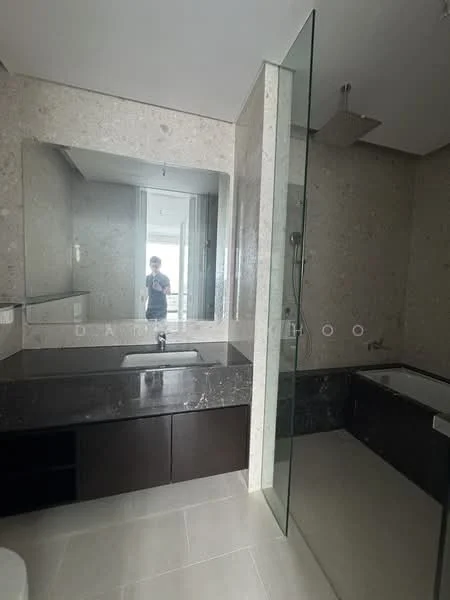 Bathroom features: grey marble wall cladding, light grey tile flooring, single-sink vanity with dark wood cabinet, black marble countertop, large frameless mirror, walk-in shower with glass enclosure, rain shower head, freestanding bathtub, chrome basin mixer faucet, window with natural light; style: modern; view: city.