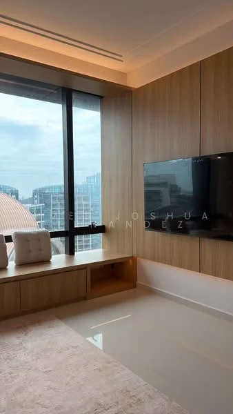 Room features: large floor-to-ceiling windows, wood paneling on walls, light-colored flooring, built-in TV unit, soft area rug, window seat with cushions, neutral color palette, modern design; style: modern; view: city.