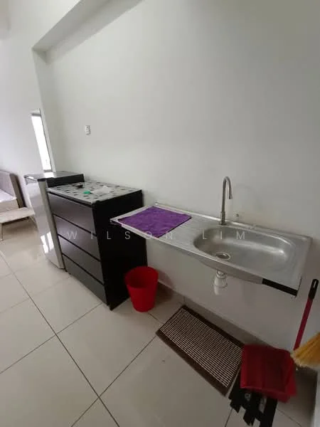 Room features: single-bowl stainless-steel sink, chrome faucet, black kitchen cabinet, white tiled backsplash, white painted walls, white floor tiles, countertop with space for appliances, red waste bin, purple dish drying mat, broom and dustpan, kitchen appliances on countertop; style: modern.