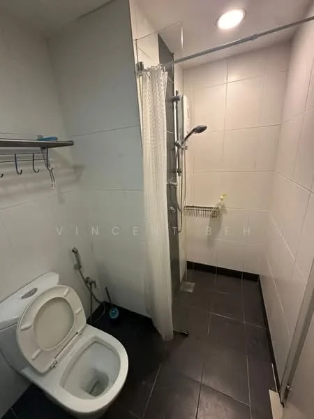 Bathroom features: white ceramic toilet, shower with glass enclosure, chrome shower head, chrome handheld shower, white shower curtain, black tile flooring, white tiled walls, wall-mounted towel rack, built-in heating unit; style: modern.