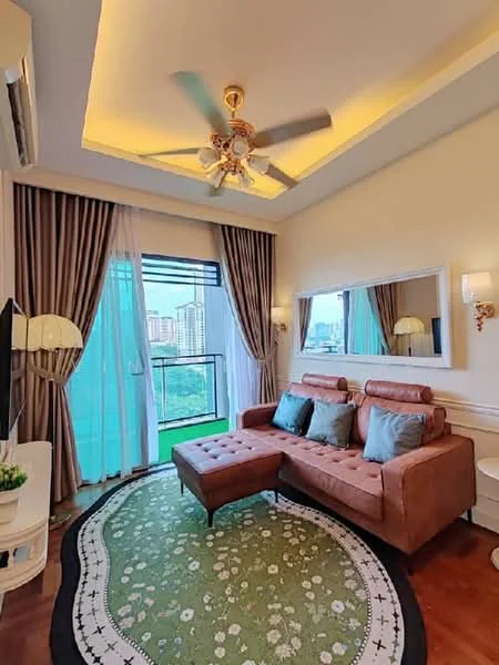 Living features: 3-seater fabric sofa in brown, chaise lounge, decorative cushions in blue, area rug with floral pattern, wall-mounted TV, floor-to-ceiling windows, sheer curtains, recessed ceiling lights, 5-blade ceiling fan with light, wall sconces, mirror on wall, greenery view from window; style: modern; view: city.