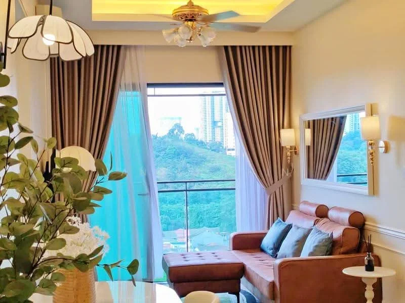 Living features: 3-seater leather sofa in brown, decorative cushions in various colors, coffee table, wall-mounted mirror, floor-to-ceiling windows, sheer curtains, heavy drapes in beige, ceiling fan with light, recessed lighting, wooden flooring, decorative plant in vase, area rug; style: modern; view: mountain.