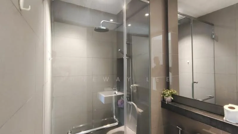 Bathroom features: glass shower enclosure, rain shower head, handheld shower, wall-mounted sink, black countertop, grey tiled walls, grey tiled flooring, recessed downlights, mirror, toilet paper holder, decorative plant; style: modern.