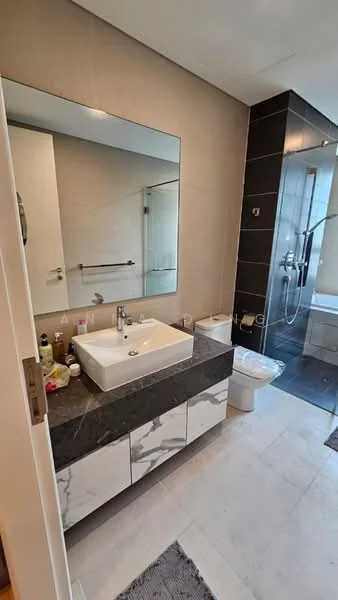 Bathroom features: single-sink vanity with marble countertop, chrome basin mixer faucet, framed mirror, one-piece toilet, walk-in shower with glass enclosure, tile cladding on walls, marble tile flooring, recessed downlights, towel rail, storage cabinets under sink; style: modern.