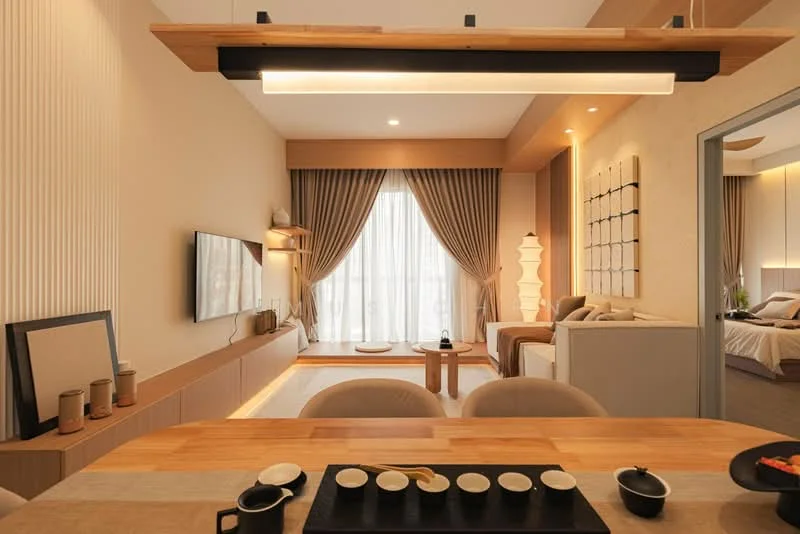 Living features: floor-to-ceiling windows, sheer curtains, wooden flooring, wall-mounted TV, light wood cabinetry, recessed lighting, sofa with cushions, coffee table, decorative wall art, area rug, decorative lamp, open-plan layout; style: modern; view: city. Dining features: round dining table, upholstered dining chairs, decorative table setting, pendant light fixture, wooden tabletop; style: modern.
