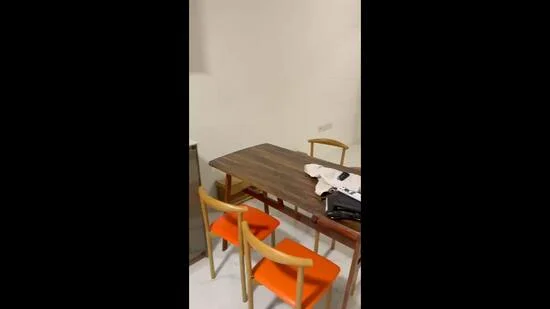 Dining features: wooden dining table, 4 wooden chairs with orange upholstery, white walls, tile flooring, decorative items on table; style: modern.