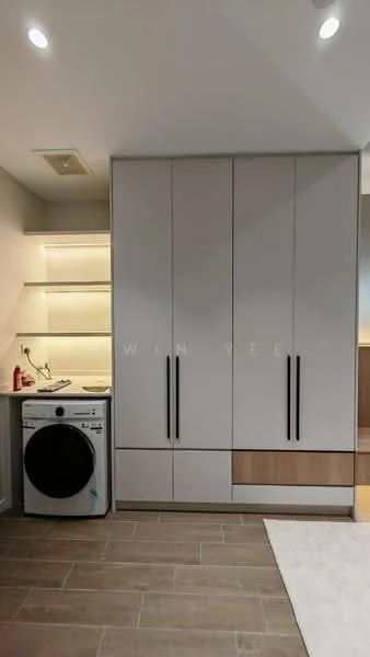Laundry features: front-load washing machine, built-in cabinetry with white finish, wooden cabinetry at the bottom, LED strip lighting, tile flooring in beige, shelf above the washing machine, neutral wall color, recessed ceiling lights; style: modern.