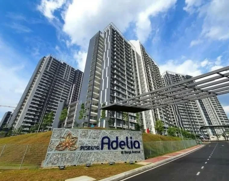 Exterior type: high-rise condominium; features: glass curtain wall, concrete facade, multiple balconies, landscaped grounds, signage with name 'Presiden Adelia', driveway with interlocking pavers, surrounded by greenery, modern architectural design; style: modern.