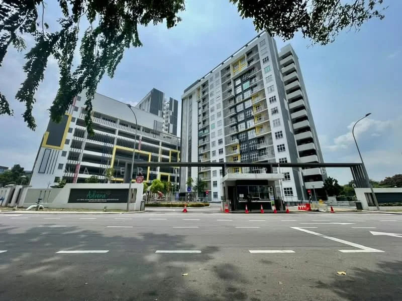 Exterior type: high-rise condominium; features: glass curtain wall, white painted facade, yellow accent panels, multiple balconies, gated entrance, security guard house, landscaped grounds, driveway with interlocking pavers; style: modern.